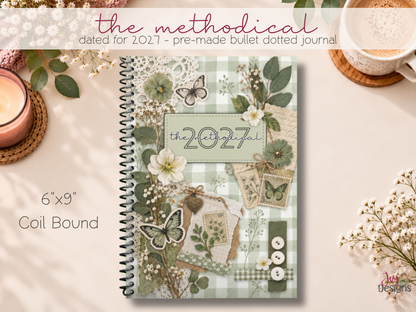 2027 The Methodical daily planner and pre made bullet journal with sage green vintage scrapbook cover featuring butterflies flowers and gingham pattern. Dated 2027 coil bound journal with soft matte cover in a portable 6x9 size. All in one daily planner for tracking habits mood water intake fitness steps gratitude and everyday journaling. Aesthetic wellness journal and daily organizer for women who love bullet journaling and beautifully designed stationery.