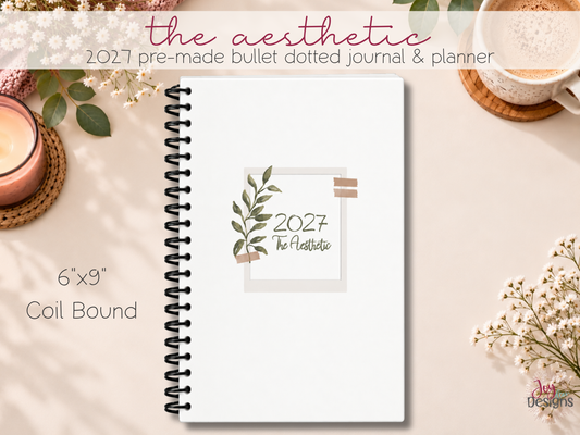 The Aesthetic 2027 premade dotted journal planner with minimalist botanical cover black plastic coil binding and soft matte finish 6x9 inch dated planner with 370 pages for creative planning organization habit tracking mood tracking anxiety tracking self care and daily routines aesthetic stationery gift for women teens students and planner lovers ready made dot grid journal with monthly calendars weekly spreads Dutch door layouts themed trackers coloring pages and blank dotted pages